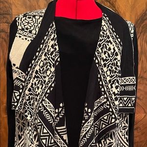 Size Medium Black and cream patterned sweater jacket.